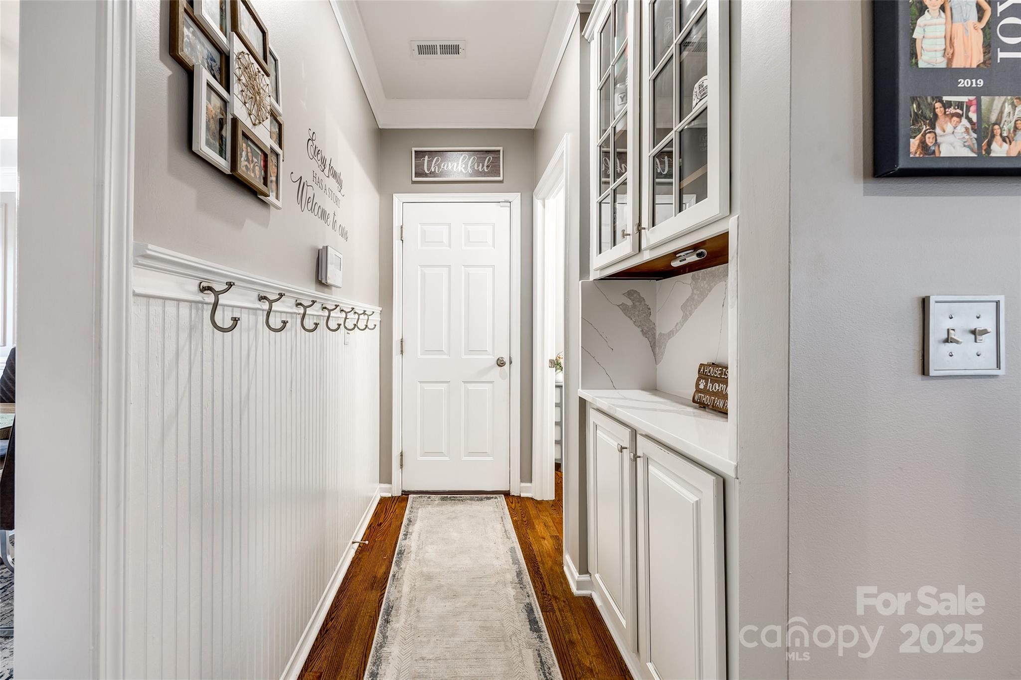 341 Fischer Road Fort Mill, SC 29715 - Photo 8 of 48 a view of a hallway with wooden floor and staircase