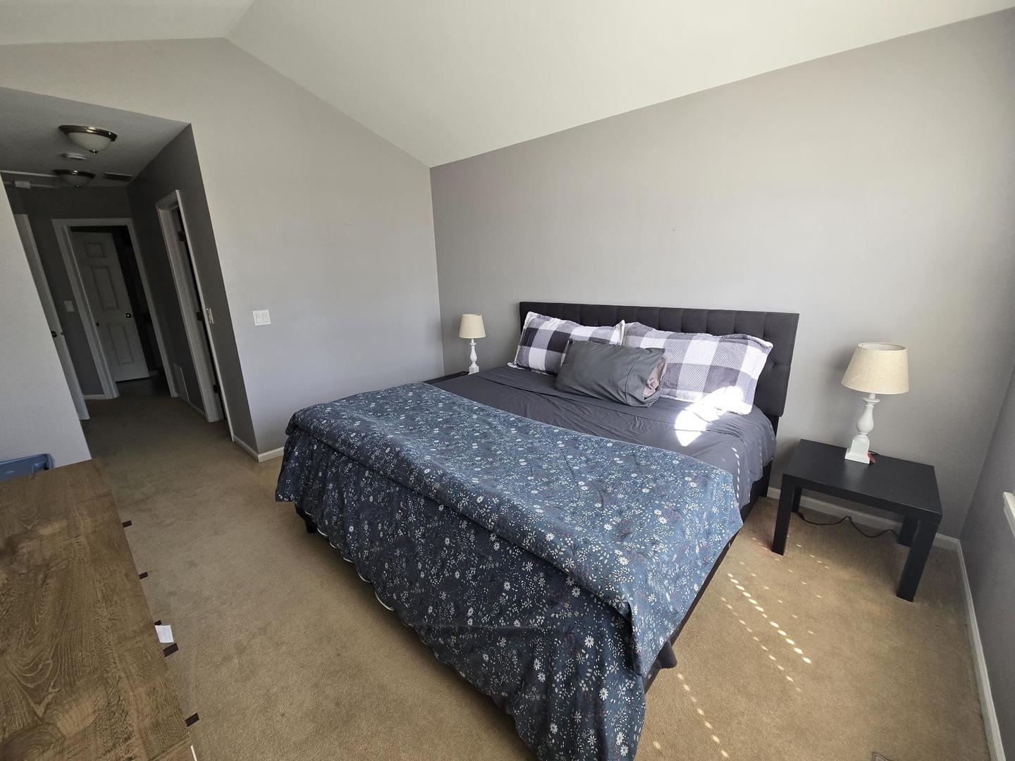 1328 Shawford Way Elgin, IL 60120 - Photo 13 of 19 a bedroom with a bed and a lamp on table