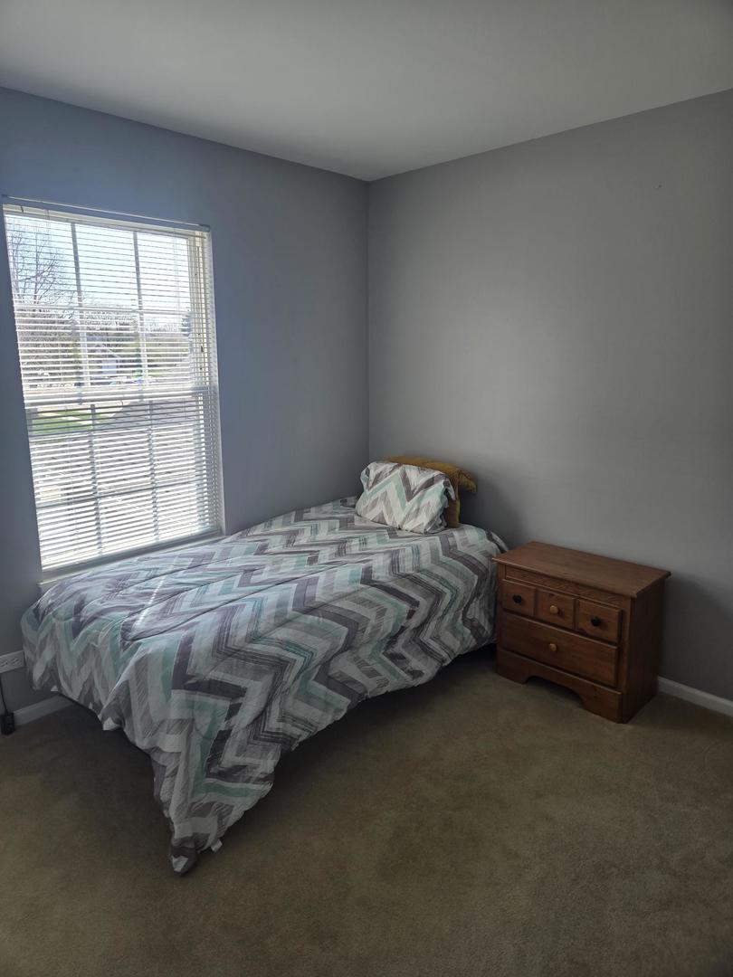 1328 Shawford Way Elgin, IL 60120 - Photo 16 of 19 a bedroom with bed and window