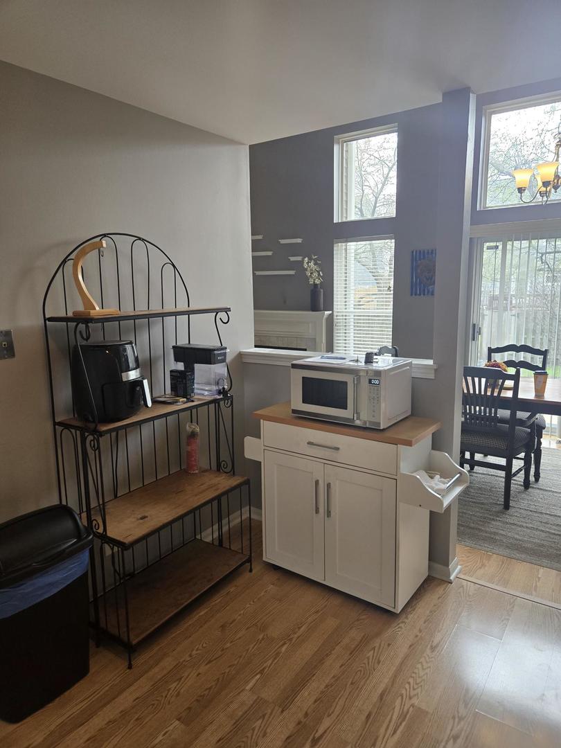 1328 Shawford Way Elgin, IL 60120 - Photo 5 of 19 a living room with furniture stairs and a window