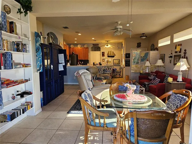 a bedroom with two beds and a painting on the wall