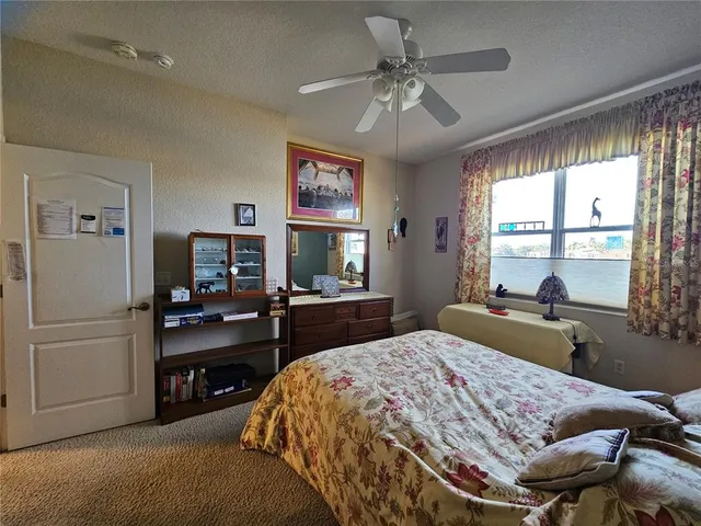 a bathroom with a sink vanity mirror and toilet