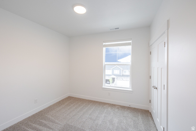 693 West 4500th South, Unit O302 Mapleton, UT 84664 - Photo 7 of 16 Empty room featuring light carpet and baseboards