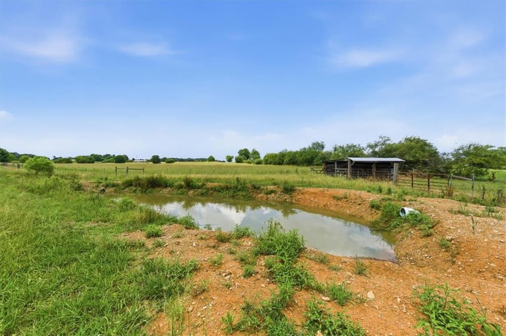 0 Plainview Road Southeast Adairsville, GA 30103 - Photo 14 of 40 a view of a lake with houses in the back