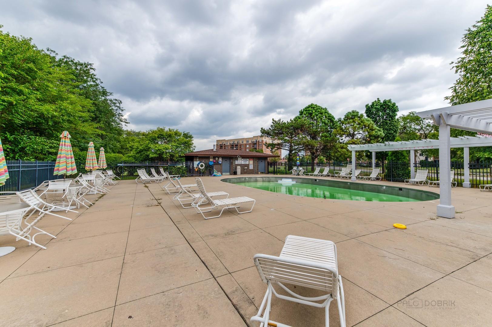 675 Grove Terrace, Unit 311 Elk Grove Village, IL 60007 - Photo 13 of 14 a backyard of a house with lots of green space