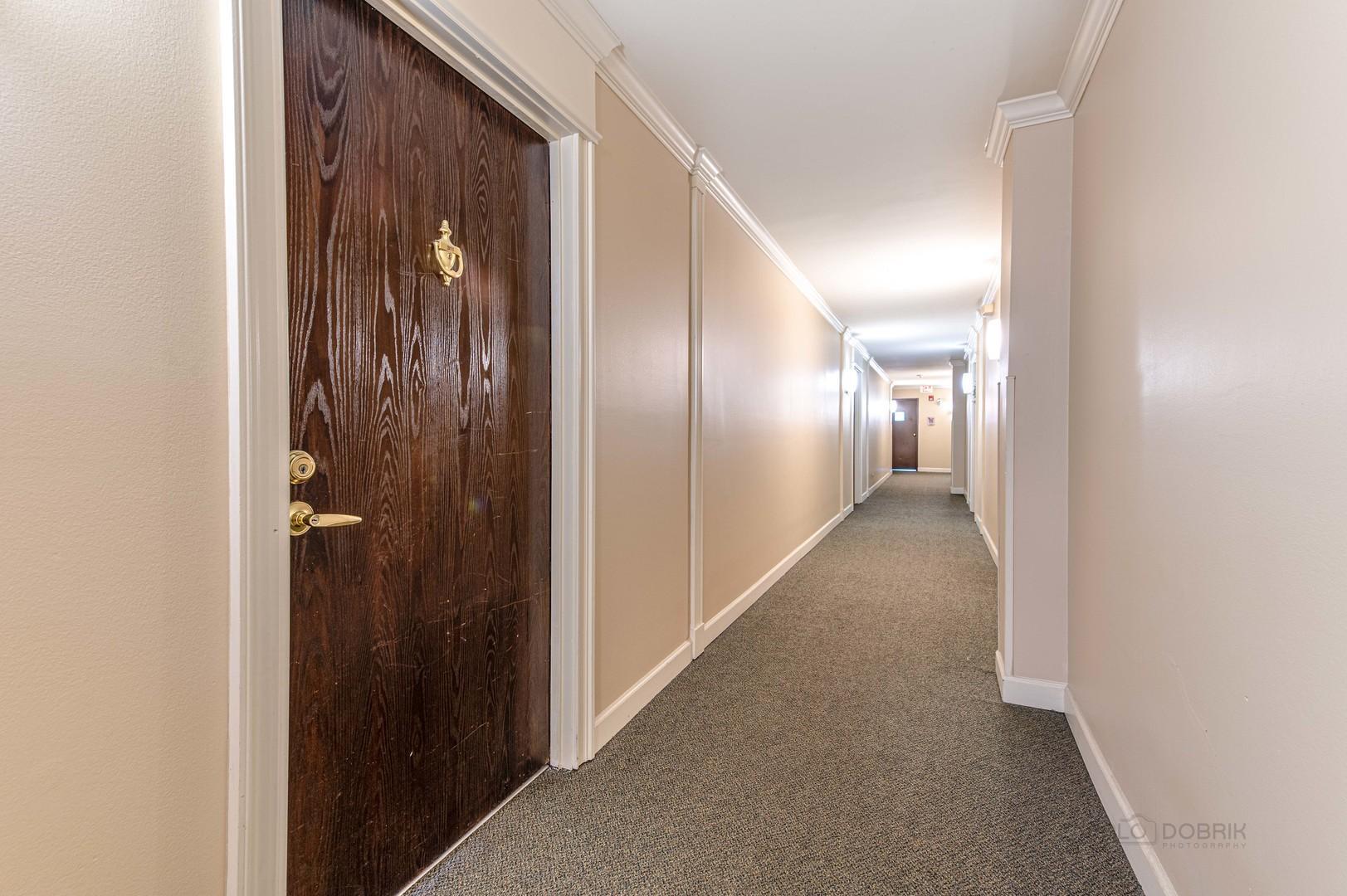 675 Grove Terrace, Unit 311 Elk Grove Village, IL 60007 - Photo 2 of 14 a view of hallway