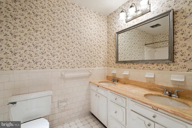 a view of a livingroom with wooden floor and a fireplace