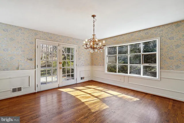 a kitchen with stainless steel appliances a refrigerator and wooden cabinets