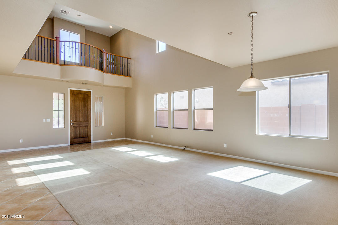 9121 West Plum Road Peoria, AZ 85383 - Photo 12 of 69 a view of an empty room with a window