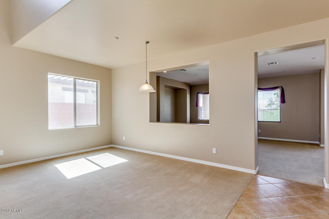 9121 West Plum Road Peoria, AZ 85383 - Photo 13 of 69 a view of an empty room with a window