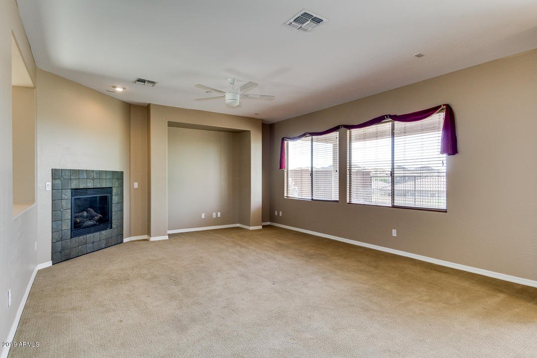 9121 West Plum Road Peoria, AZ 85383 - Photo 14 of 69 an empty room with windows