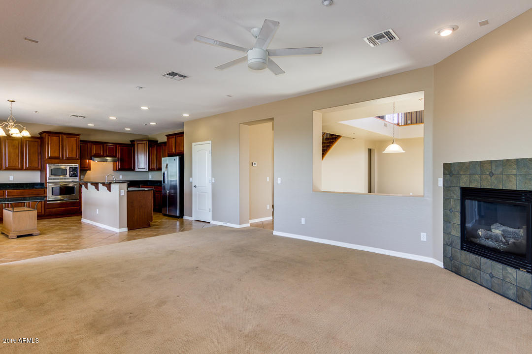 9121 West Plum Road Peoria, AZ 85383 - Photo 16 of 69 a view of a kitchen with a sink and a kitchen