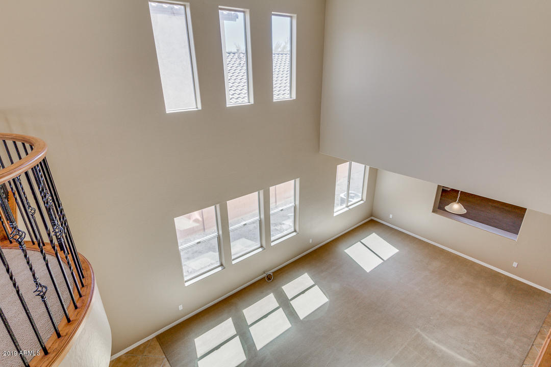 9121 West Plum Road Peoria, AZ 85383 - Photo 33 of 69 a view of an empty room with windows