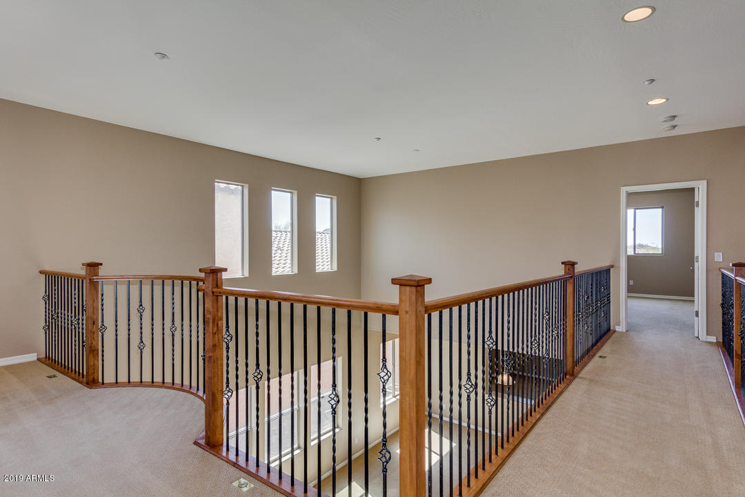 9121 West Plum Road Peoria, AZ 85383 - Photo 34 of 69 a view of a hallway with closet area