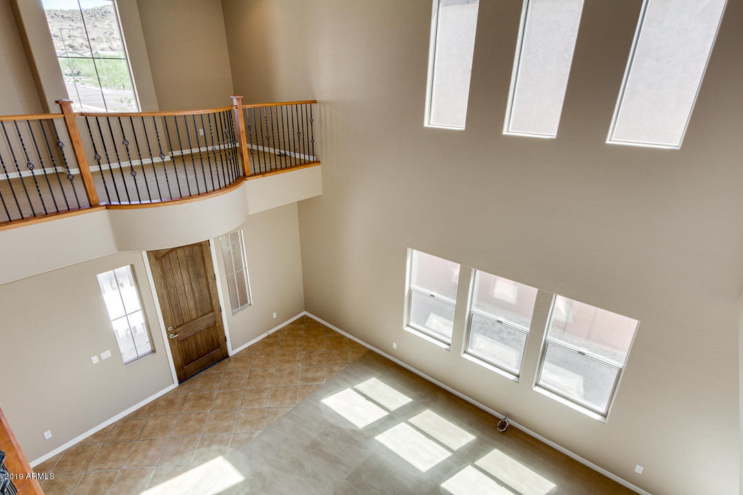 9121 West Plum Road Peoria, AZ 85383 - Photo 36 of 69 a view of an entryway with wooden floor