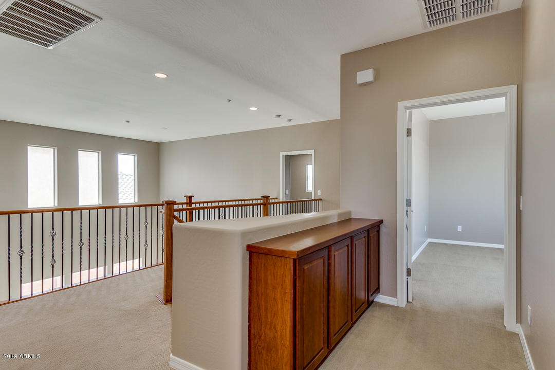 9121 West Plum Road Peoria, AZ 85383 - Photo 38 of 69 a view of a kitchen from the hallway