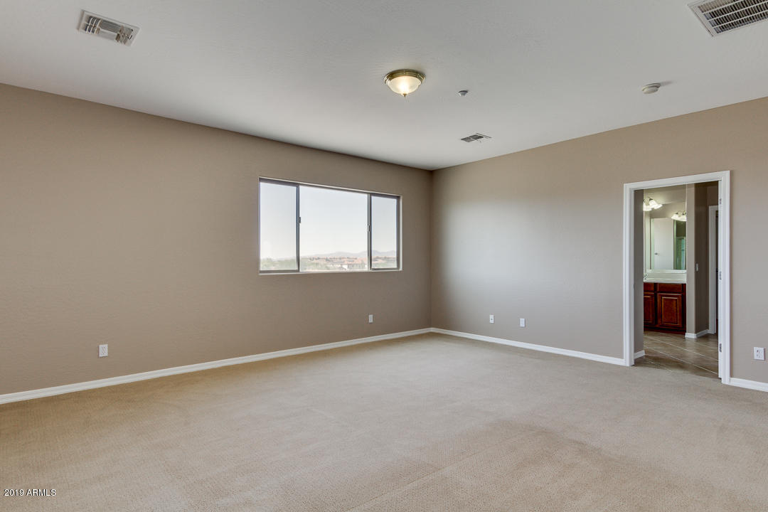 9121 West Plum Road Peoria, AZ 85383 - Photo 41 of 69 a view of an empty room with a window