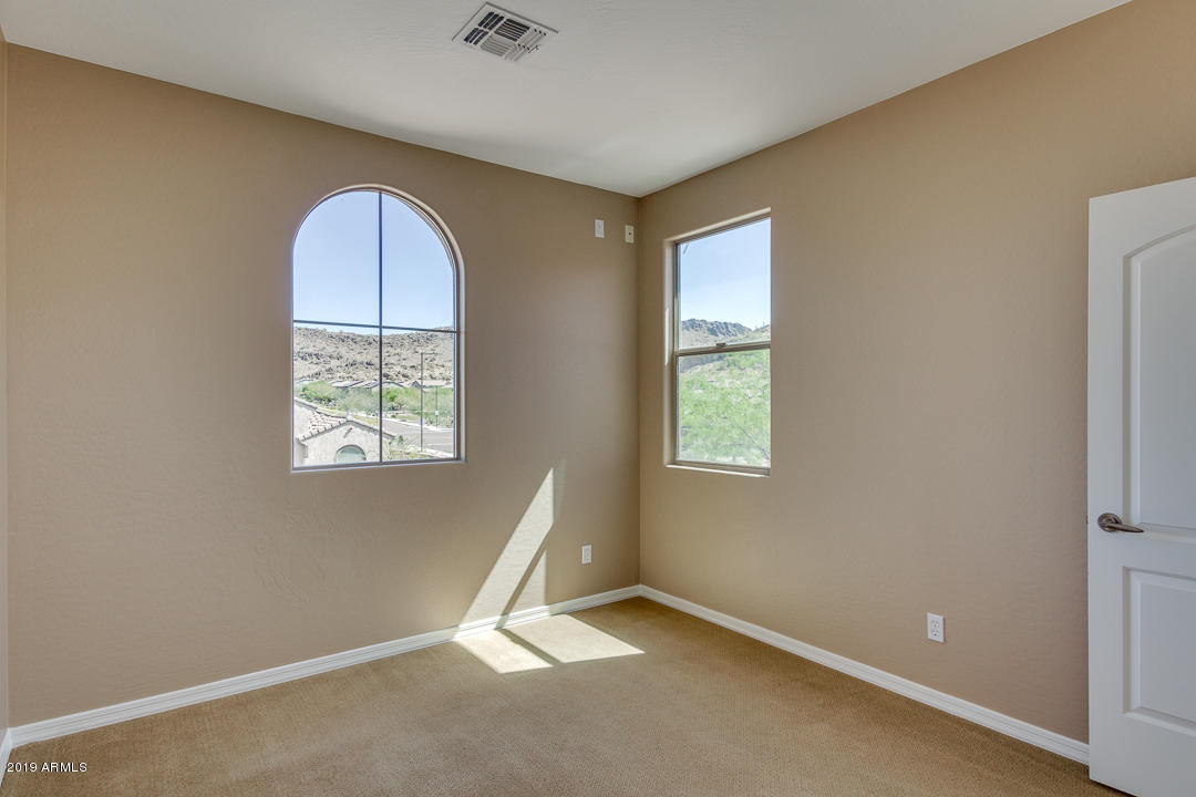 9121 West Plum Road Peoria, AZ 85383 - Photo 46 of 69 an empty room with windows