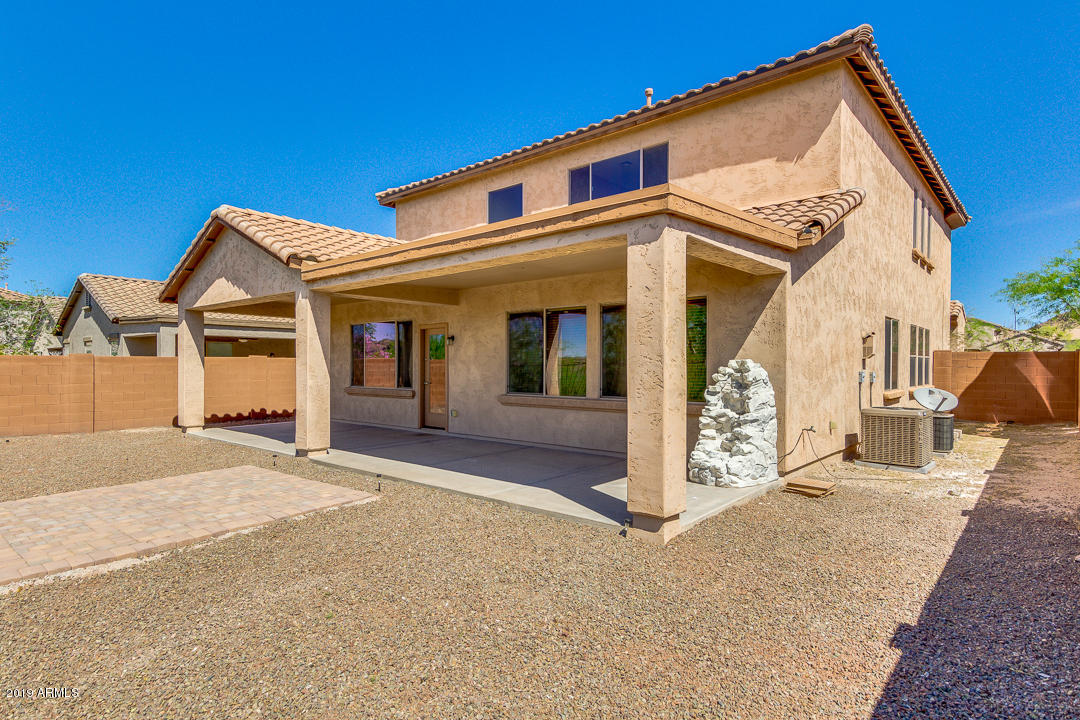 9121 West Plum Road Peoria, AZ 85383 - Photo 52 of 69 a view of a house with large windows