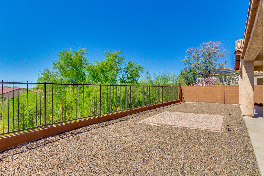 9121 West Plum Road Peoria, AZ 85383 - Photo 56 of 69 a view of street with a yard