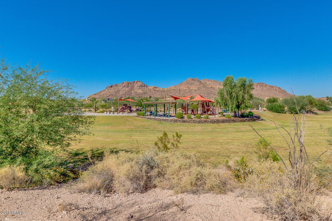 9121 West Plum Road Peoria, AZ 85383 - Photo 61 of 69 a view of an ocean with a mountain in the background