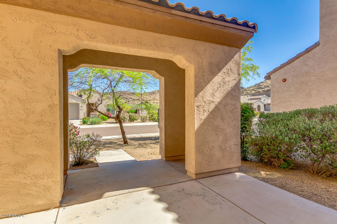 9121 West Plum Road Peoria, AZ 85383 - Photo 7 of 69 a view of a house with a porch