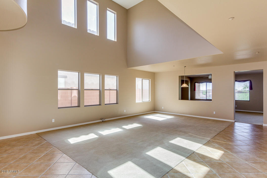 9121 West Plum Road Peoria, AZ 85383 - Photo 9 of 69 a view of an empty room with a window