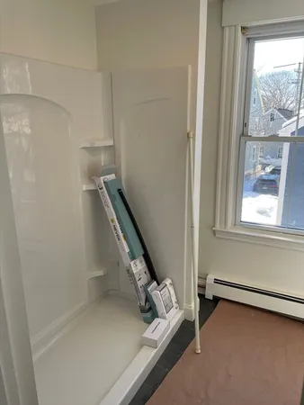 a view of an empty room with windows