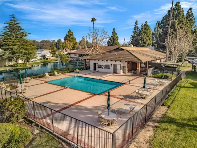 a view of a swimming pool with lounge chairs