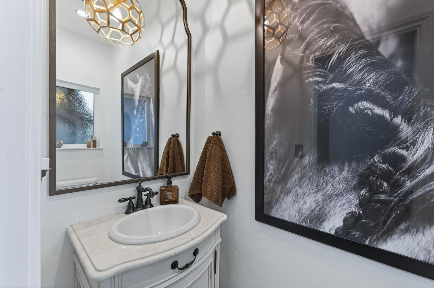 601 Decatur Avenue Clovis, CA 93611 - Photo 39 of 62 a bathroom with a sink mirror and vanity