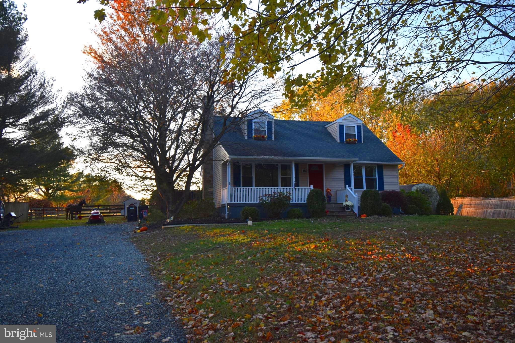 87 Half Mile Turn Rising Sun, MD 21911 - Photo 2 of 31 a front view of a house with garden