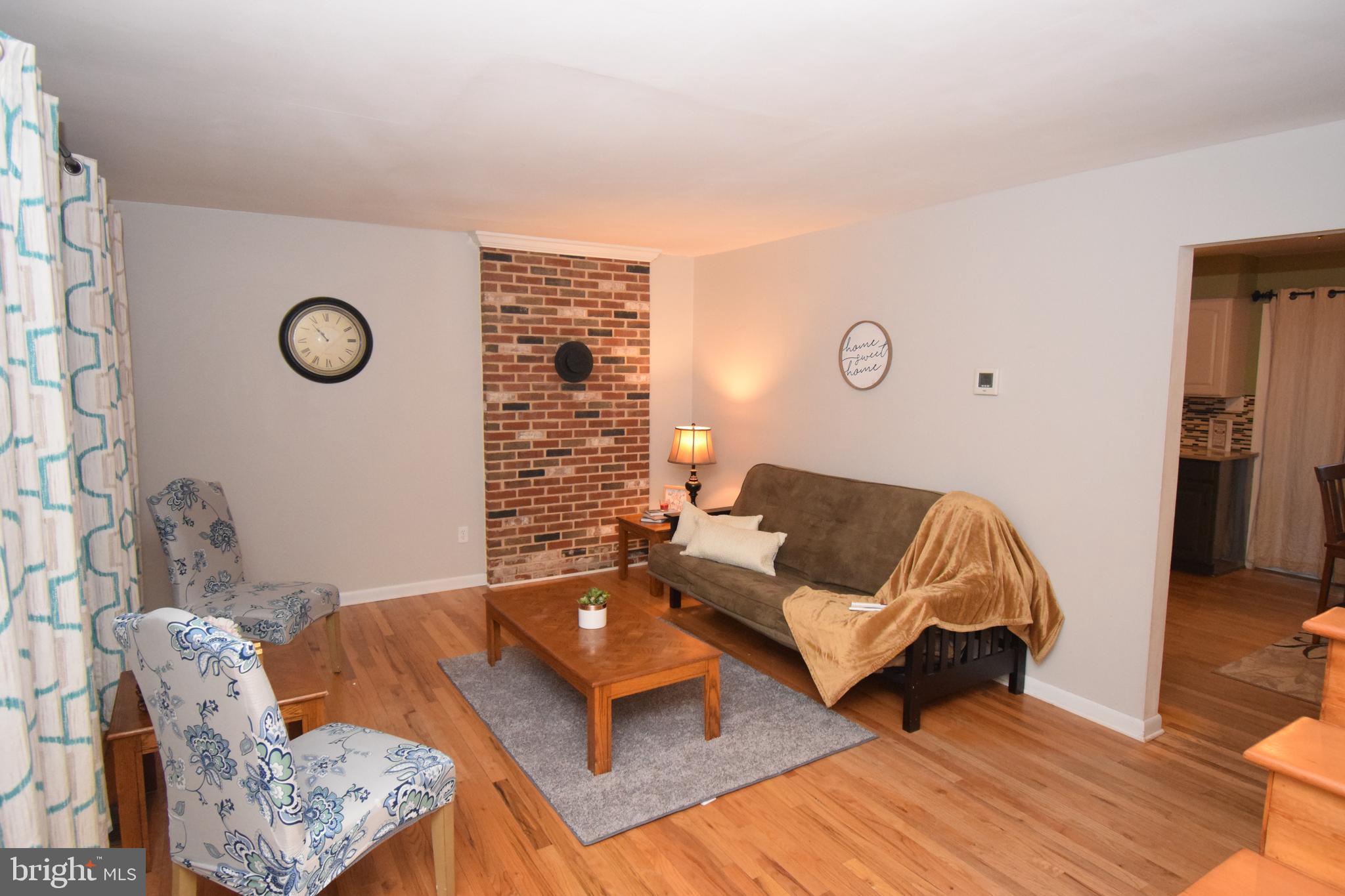 87 Half Mile Turn Rising Sun, MD 21911 - Photo 12 of 31 a living room with furniture and wooden floor