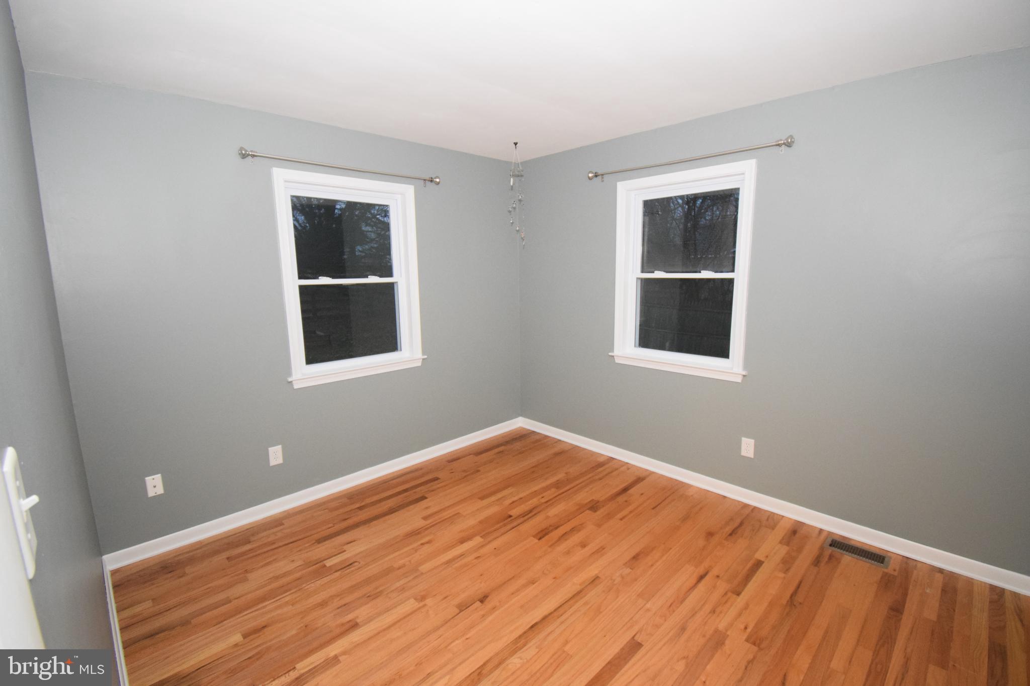 87 Half Mile Turn Rising Sun, MD 21911 - Photo 23 of 31 a view of an empty room with wooden floor and a window