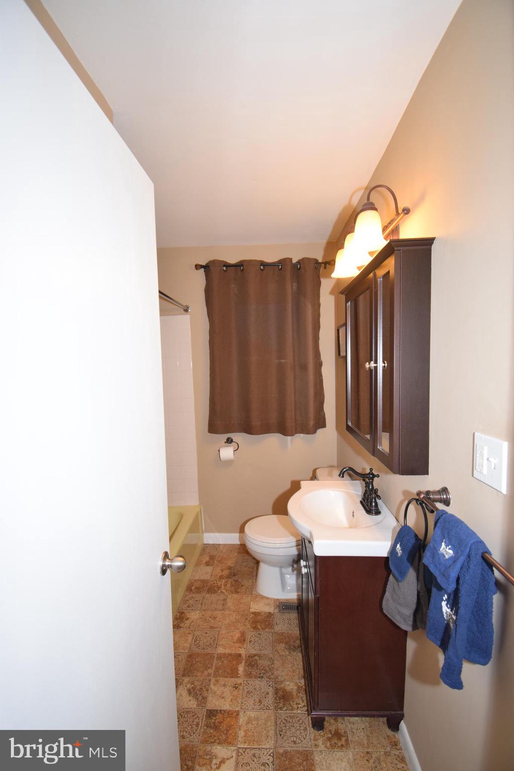 87 Half Mile Turn Rising Sun, MD 21911 - Photo 24 of 31 a bathroom with a sink and a mirror