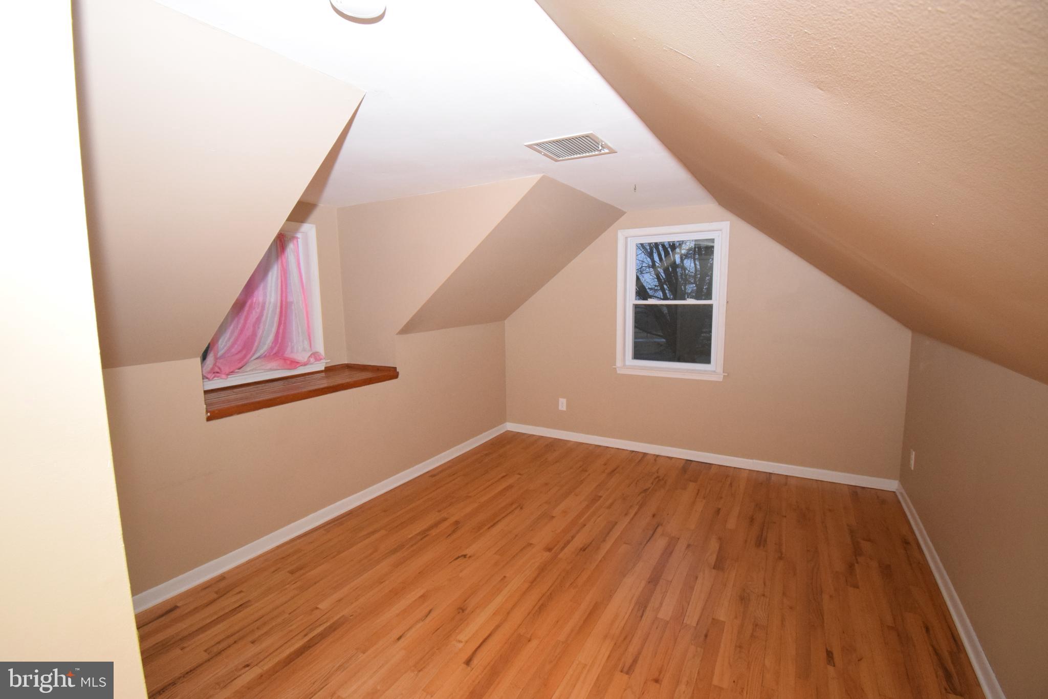 87 Half Mile Turn Rising Sun, MD 21911 - Photo 26 of 31 a view of a hallway with wooden floor and staircase