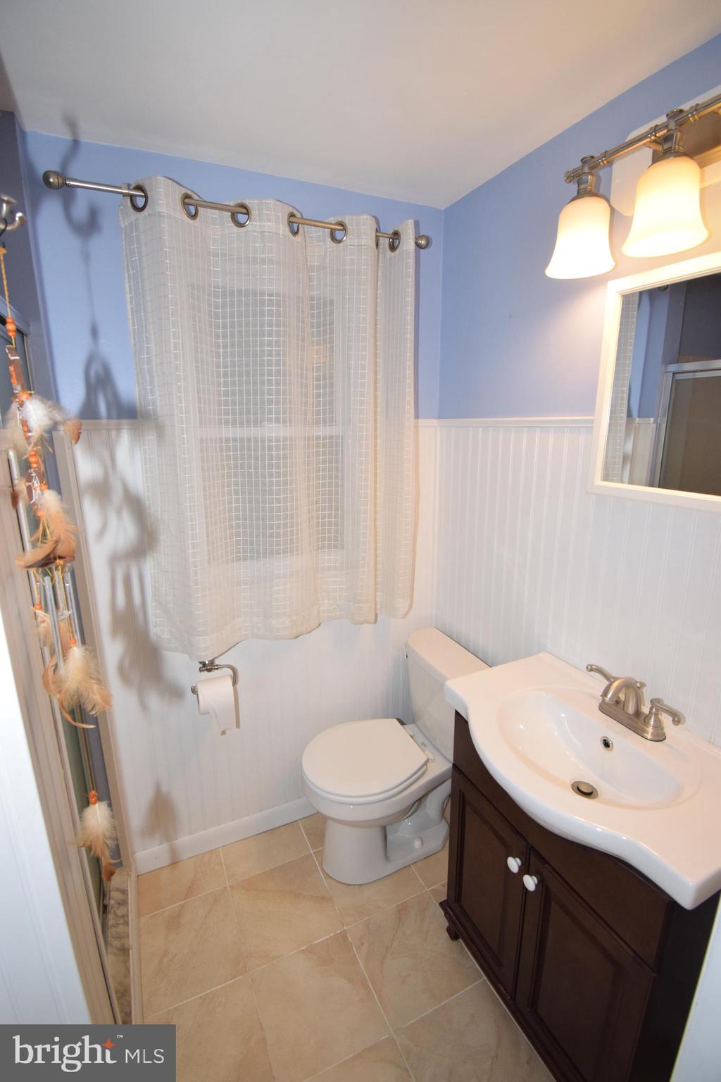 87 Half Mile Turn Rising Sun, MD 21911 - Photo 27 of 31 a bathroom with a sink toilet and shower
