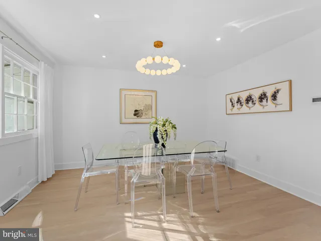 a dining room with table and chairs