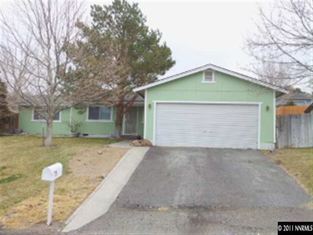 15087 Limonite Court Reno, NV 89521 - Photo 1 of 1 a front view of a house with a yard and garage