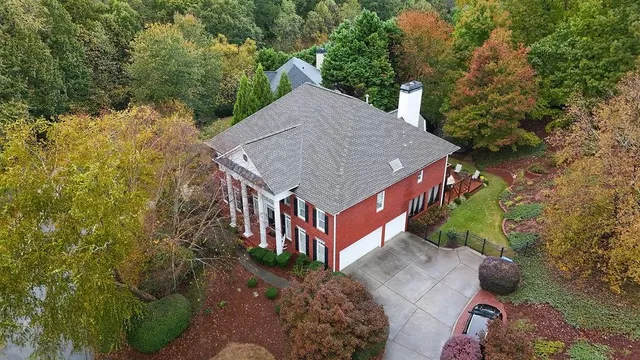 a aerial view of a house with a yard