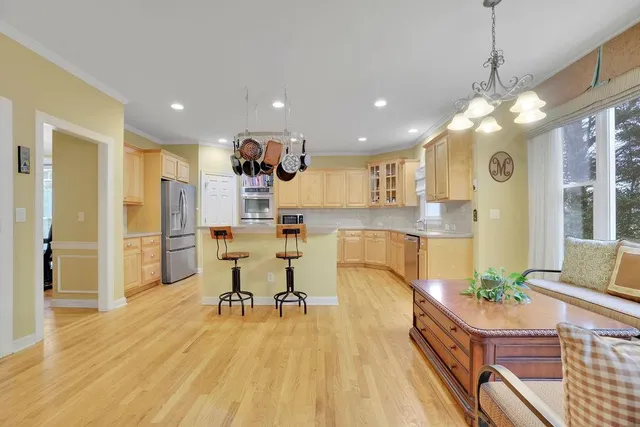 a kitchen with stainless steel appliances granite countertop a stove and a sink