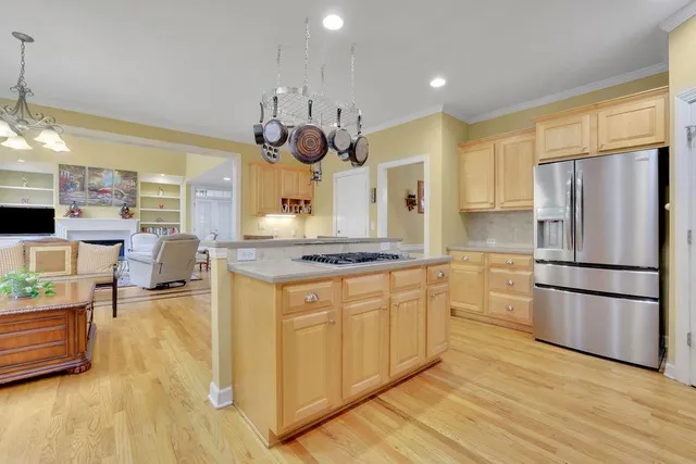 a view of a hallway with a livingroom and furniture
