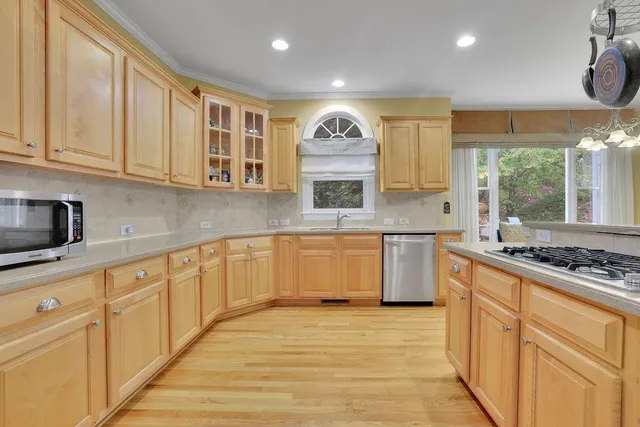 a en suite bathroom with a sink double vanity and tub
