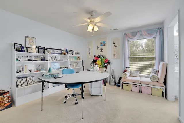 a bathroom with a tub a sink and a mirror