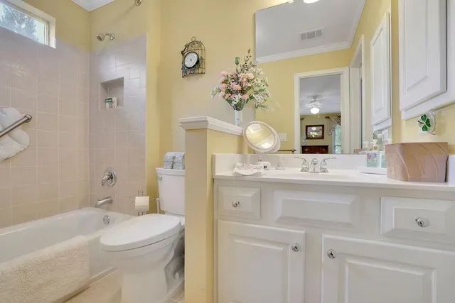a spacious bathroom with a granite countertop sink and a mirror
