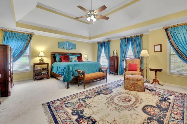 a spacious bathroom with a mirror and a shower