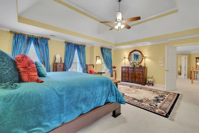 a bathroom with a tub a sink and mirror