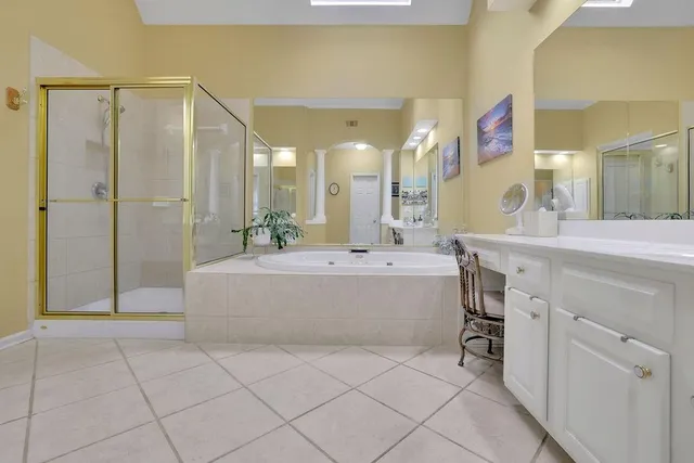 a bedroom with bed and wooden floor