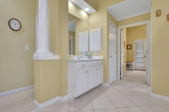 a spacious bathroom with a double vanity sink and a mirror
