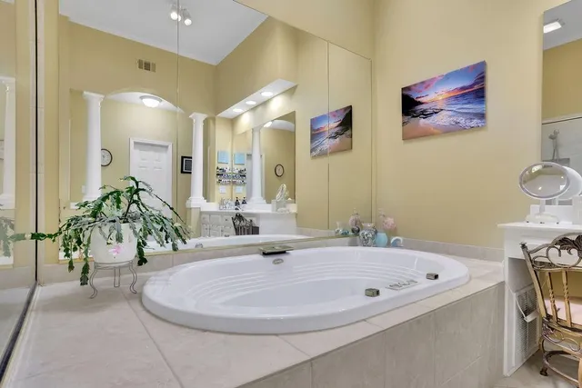 a view of a livingroom with workspace and a window