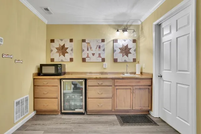 a view of a patio with table and chairs and couches